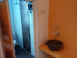 Shower, free toiletries, slippers, towels