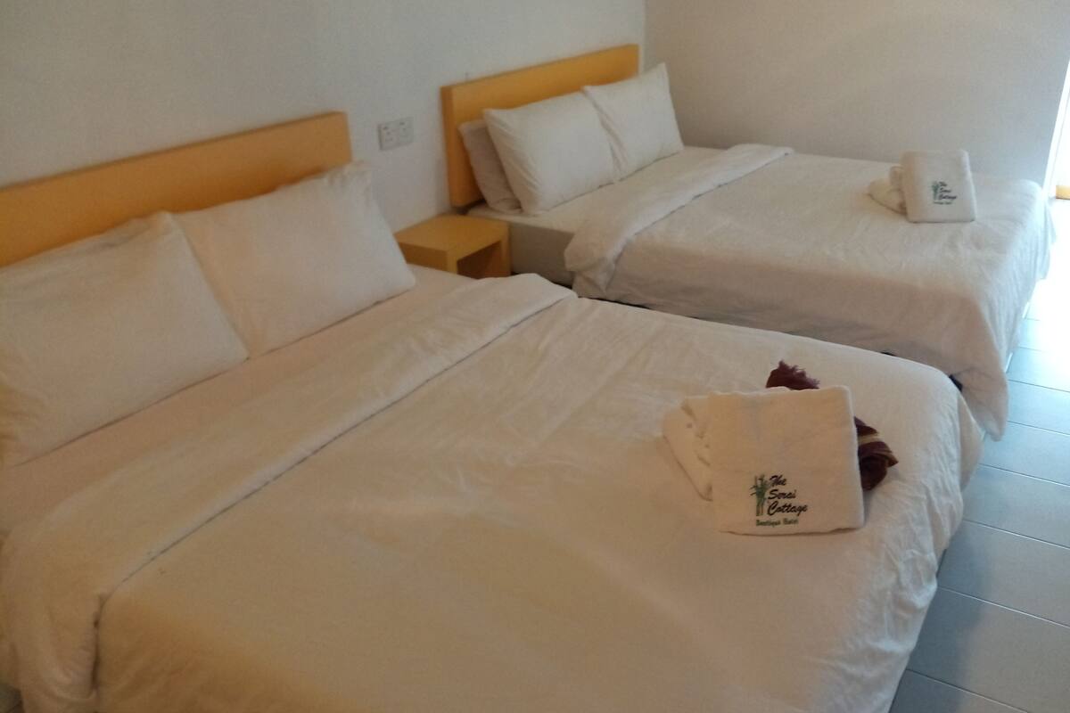 Family Room, 2 Queen Beds, Non Smoking | Iron/ironing board, free WiFi, bed sheets