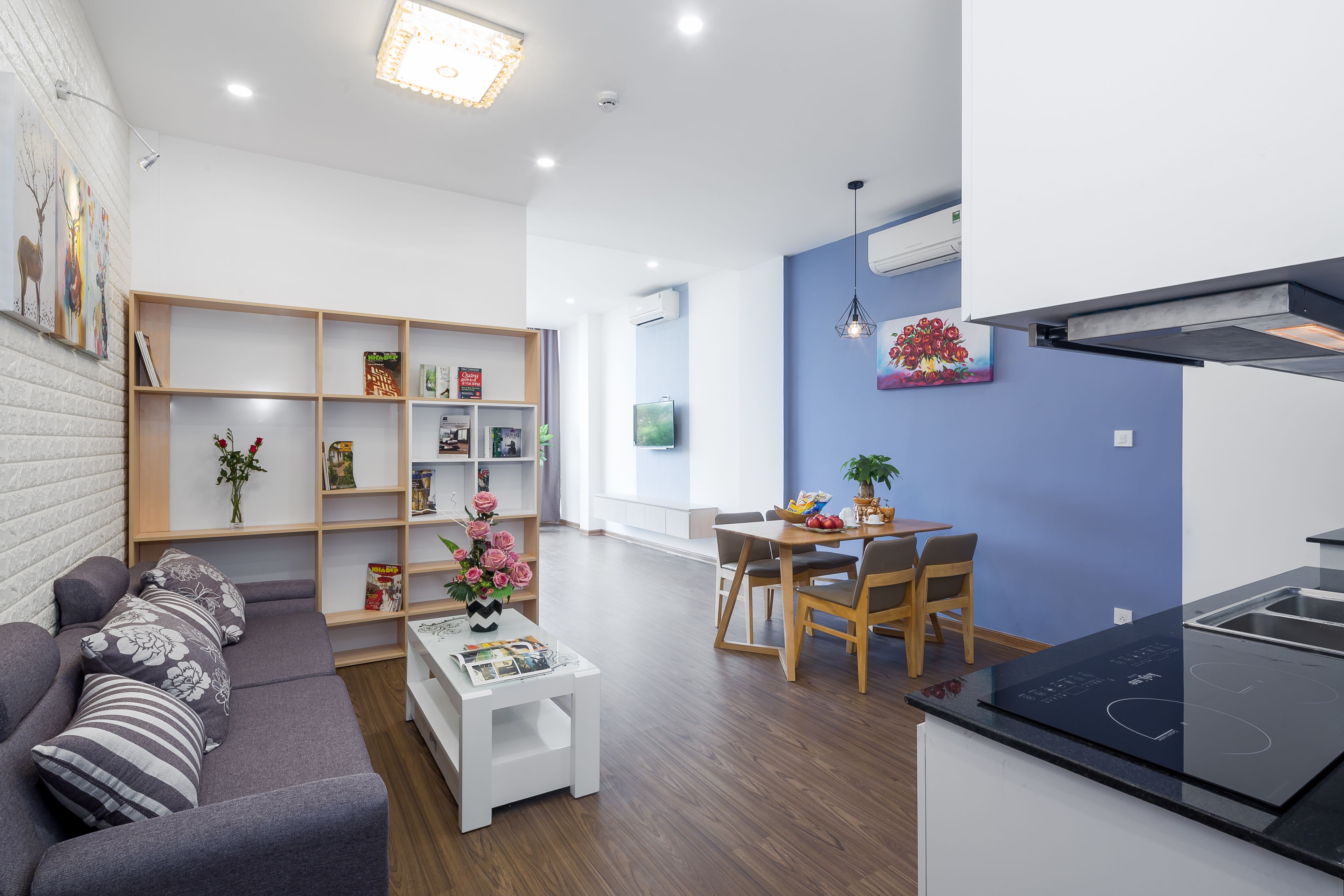 city apartment, 1 queen bed, smoking, city view | living area | smart tv