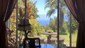 A room with a view of a garden and the ocean. - Amazing VIEWS, Spacious, Farmstead Living, Hosts with Aloha (Hawi)