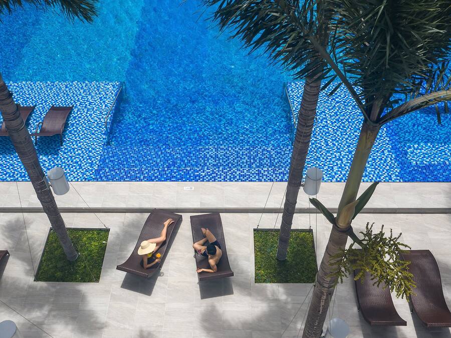 Outdoor pool, open 6:00 AM to 9:00 PM, pool loungers