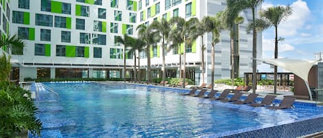 Outdoor pool, open 6:00 AM to 9:00 PM, pool loungers