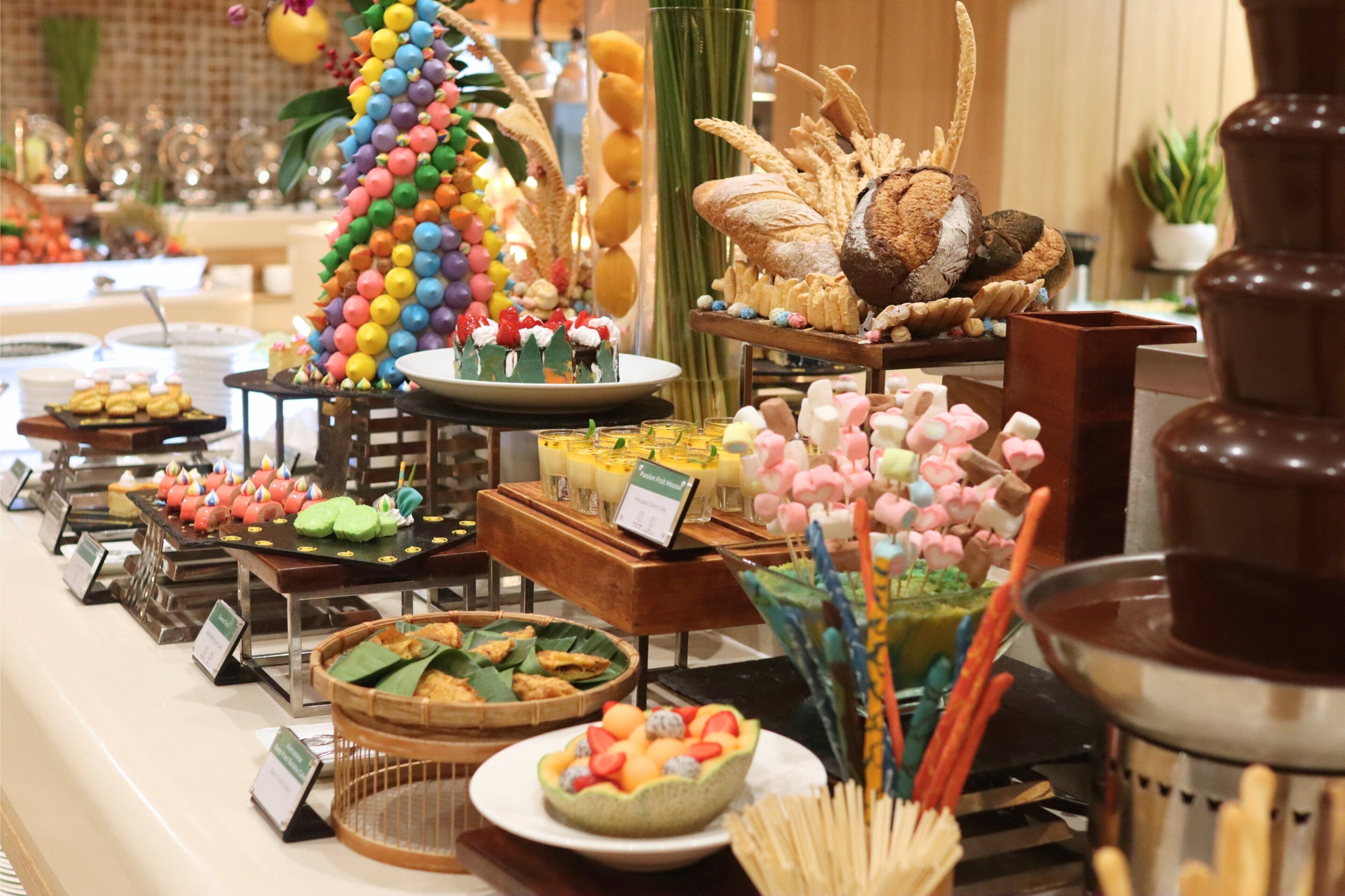 A buffet with various food items and decorations.