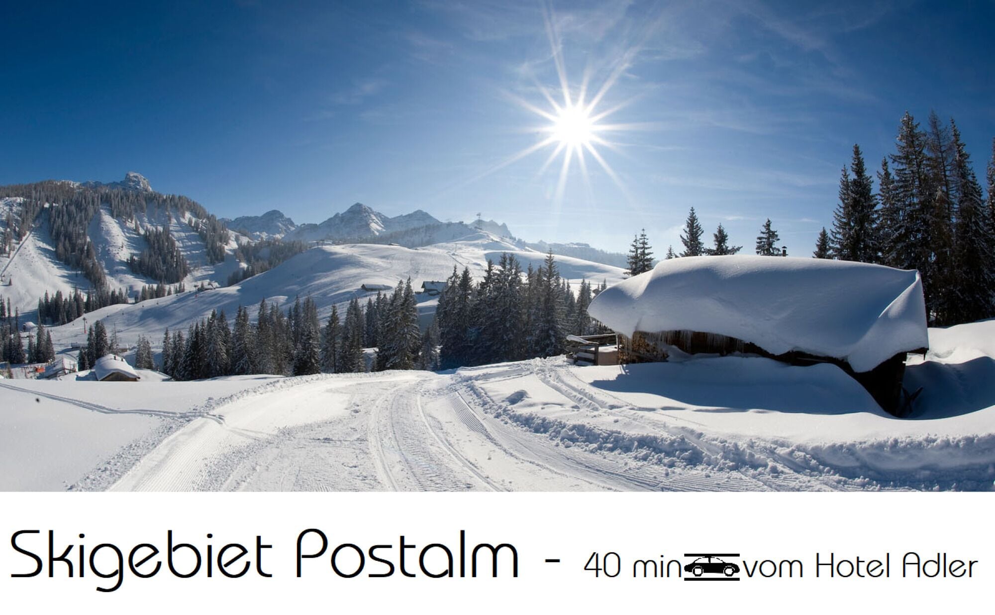 A snowy mountain landscape with a clear sky and a bright sun.