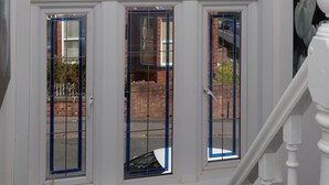 A multi-story building with a white exterior and multiple windows. - Kirkstall House (Leeds)