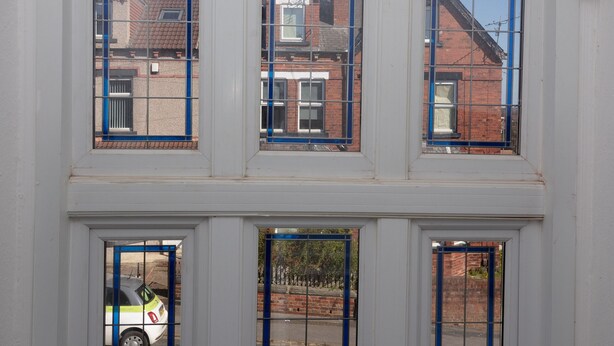 A building with multiple windows and a door. - Kirkstall House (Leeds)