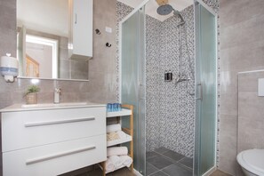 Shower, hair dryer, towels, soap