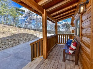 Sit on the covered porch and enjoy the serene surroundings.