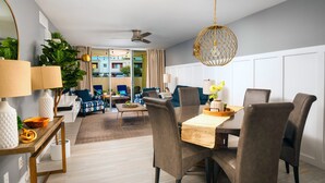 A modern living room with a dining area, featuring a wooden dining table, comfortable seating, and a ceiling fan. - ❤️COMPLETE REMODEL - Old Town Scottsdale, 2BR/2BA En-Suite, Htd Pool, Spa!!! ❤️ (Scottsdale)