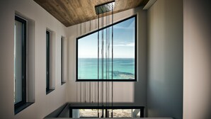 A modern interior with large windows offering a view of the sea. - Sueño LUXURY VILLA 180 Iconic Sea View (Zakynthos)