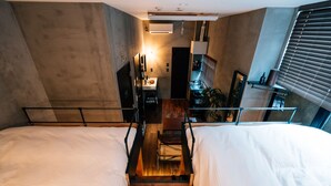 A modern hotel room with two beds, a desk, and a small kitchenette. - mizuka Nakasu 1 - unmanned hotel - (Fukuoka)