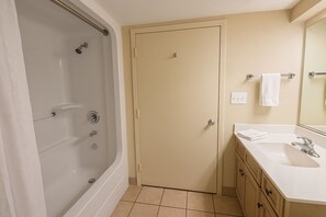 Combined shower/tub, hair dryer, towels, soap
