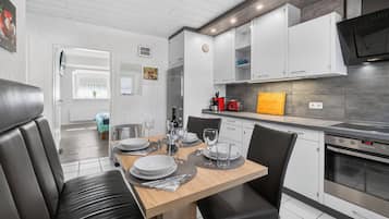 Coffee/tea maker, fridge, microwave, oven