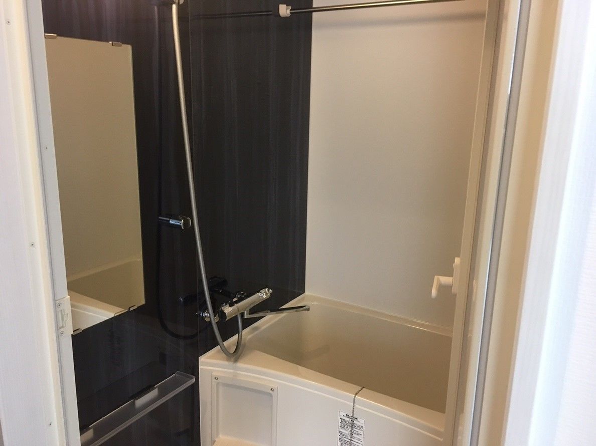 A bathroom with a bathtub, a shower, and a toilet.