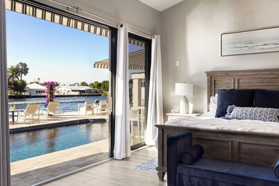 STUNNING - ON THE WATER!! - HEATED POOL - HOT TUB - WALK TO BEACH 