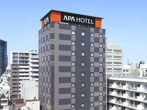 A multi-story building with "APA HOTEL" signage at the top. - APA Hotel Ueno Inaricho Ekikita (Tokyo)