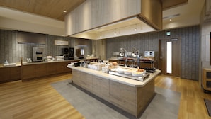 Une cuisine moderne dotée d’un îlot central, de meubles en bois et d’un four à micro-ondes encastré.