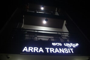 A building with a sign reading "ARRA TRANSIT" in English and another language. - Arra transit (Bengaluru)