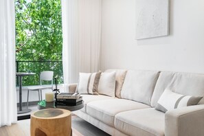 Two Bedroom Apartment with Balcony (stairs only) - 2 Yaavets St | Living area | 50-inch flat-screen TV with cable channels, Smart TV - Mr. Yavos - By TLV2GO (Tel Aviv)