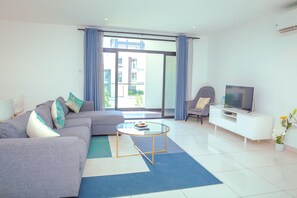 Executive Apartment | Living area | Flat-screen TV - Embassy Gardens Premier Suites (Accra)