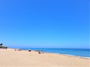 On the beach, sun-loungers