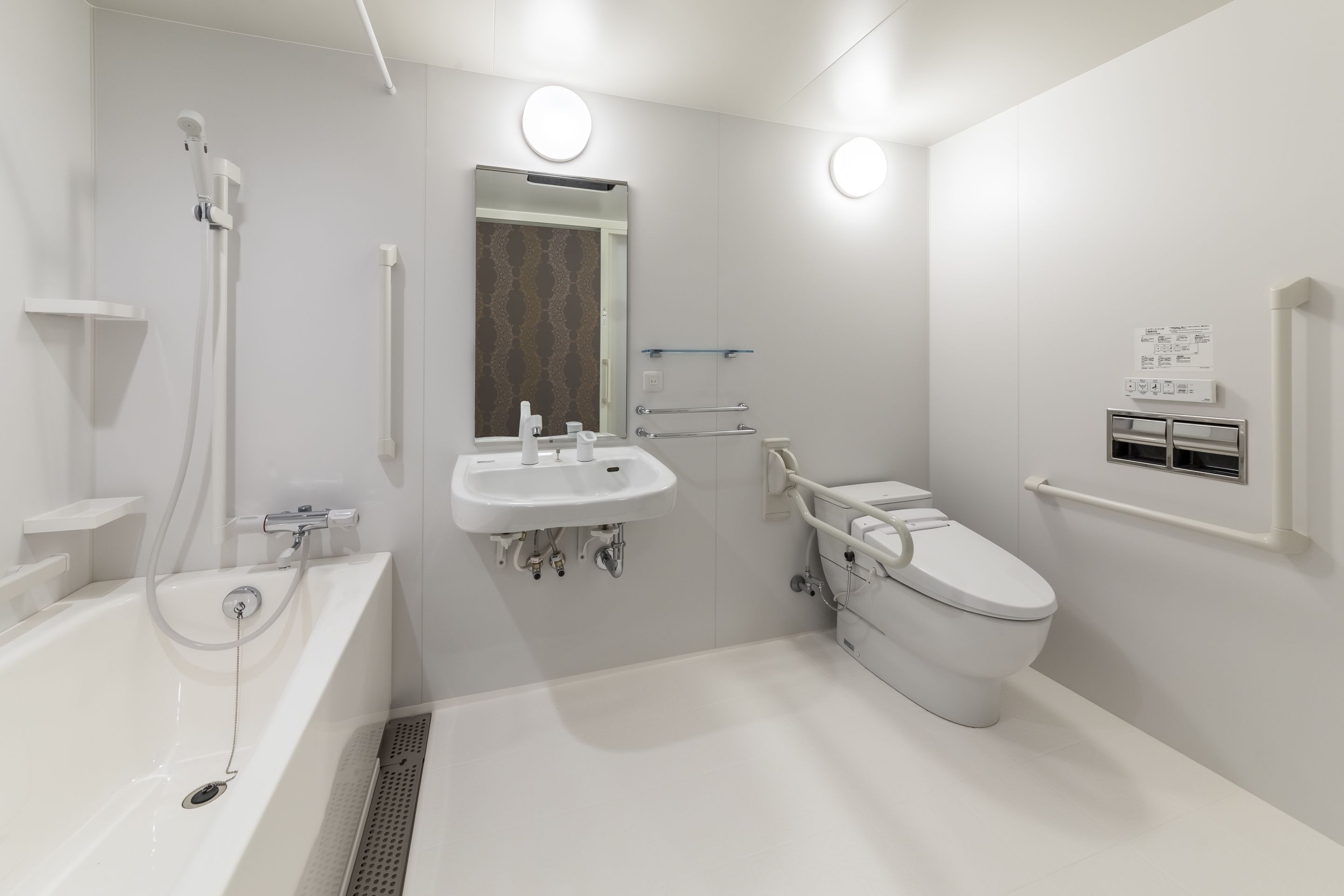 twin room - disability access, non smoking | bathroom | combined shower/bathtub, hair dryer, slippers, electronic bidet