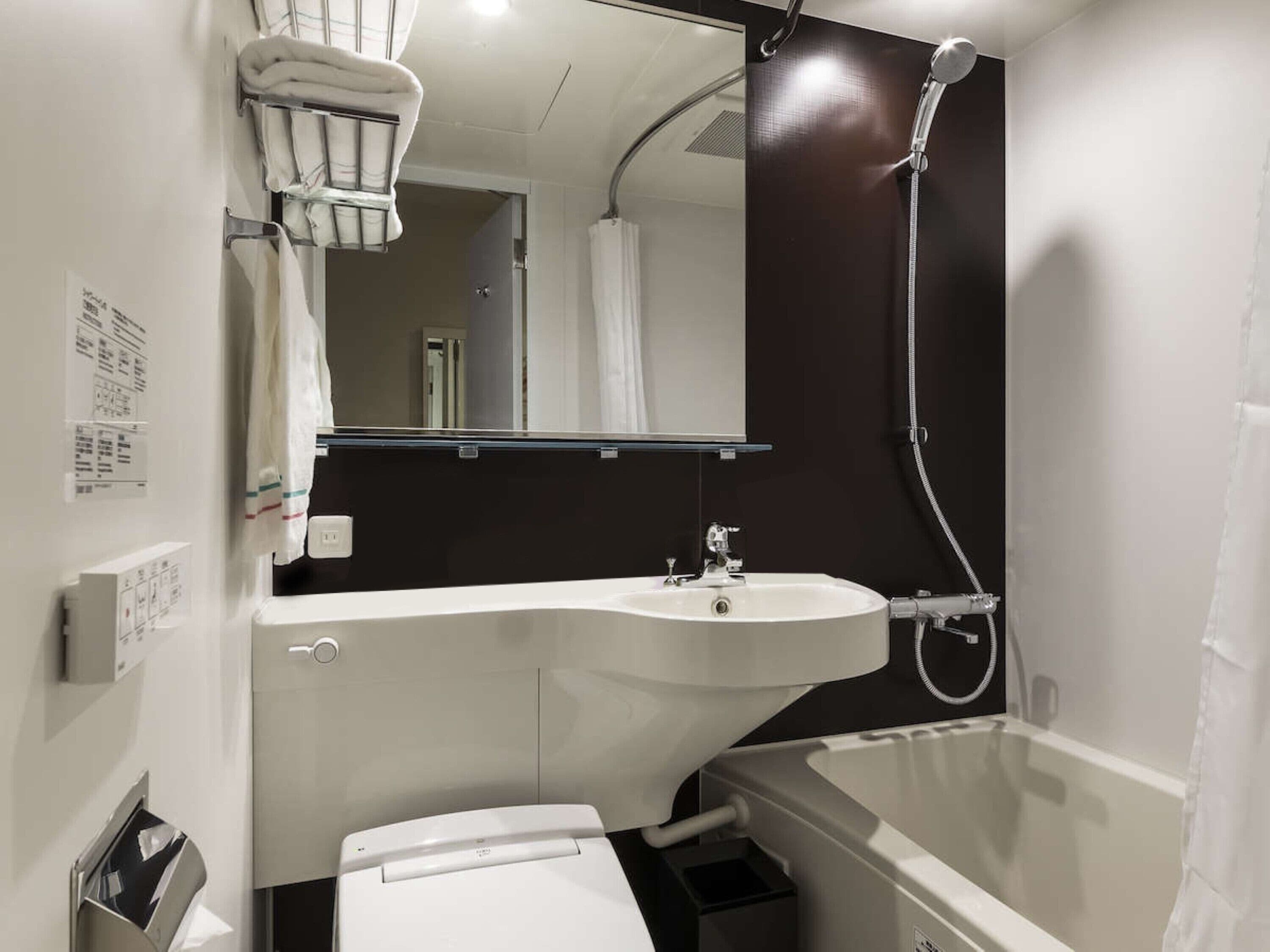 combined shower/bathtub, hair dryer, slippers, electronic bidet