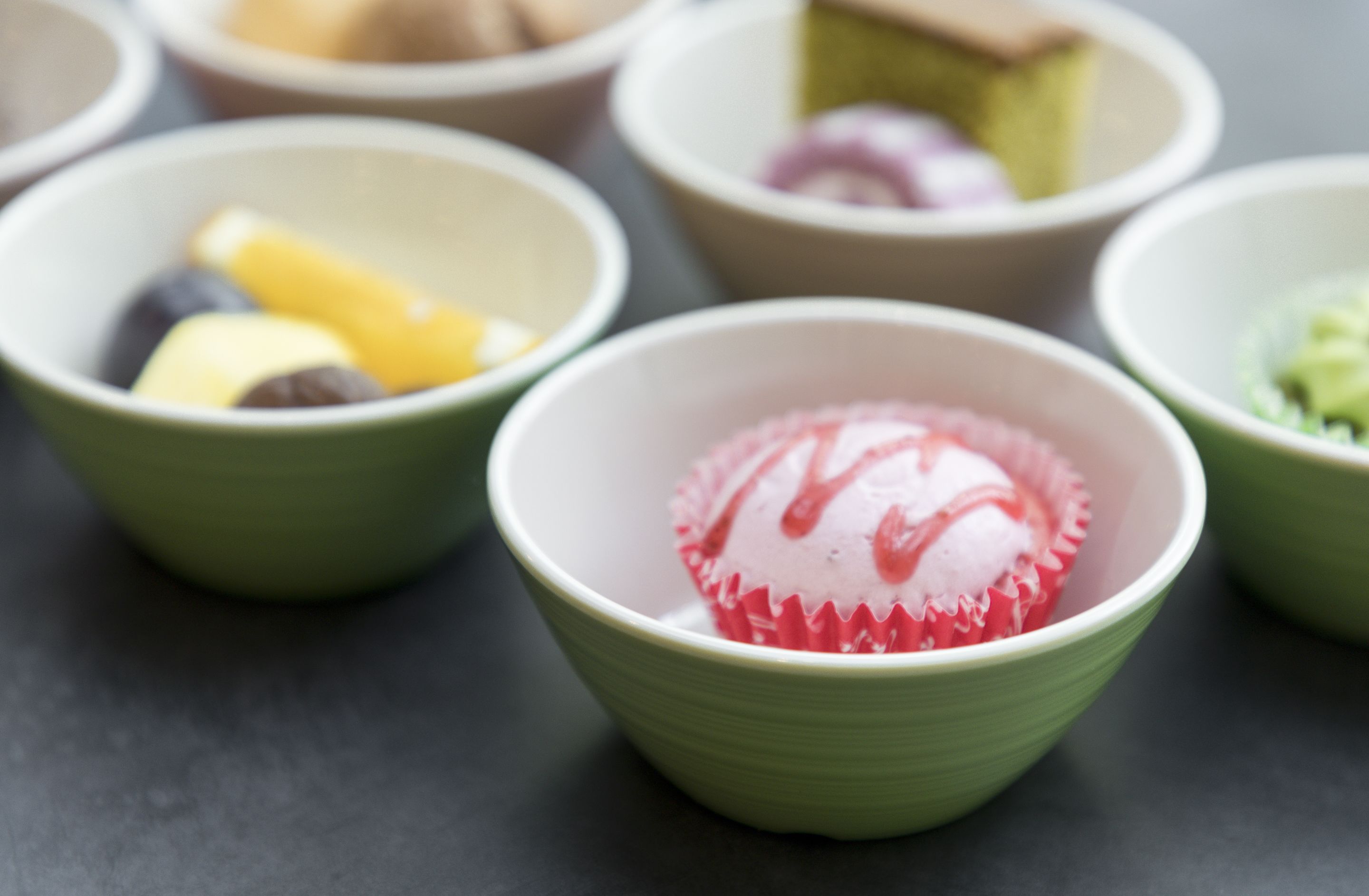 A close-up of various bowls containing different food items.