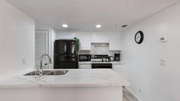 Coffee/tea maker, fridge, microwave, oven