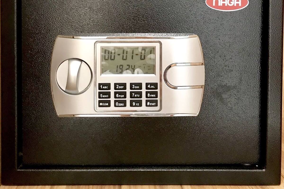 A NAGA branded safe with a digital keypad and a display showing the time and date.