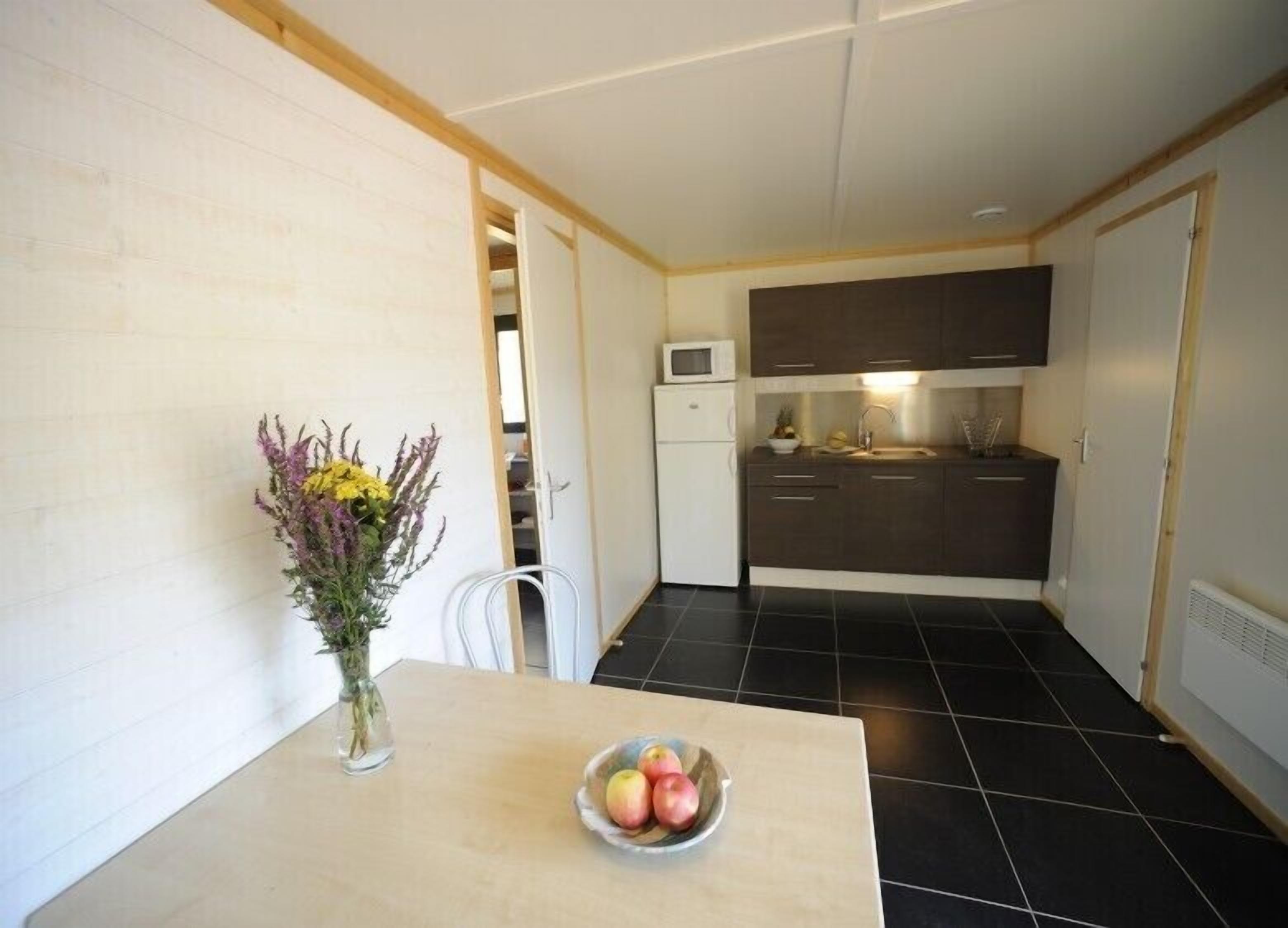 Full-sized fridge, microwave, stovetop, cookware/dishes/utensils