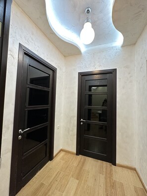 Departamento de lujo, varias camas, para no fumadores, vista a la ciudad | Área de sala de estar