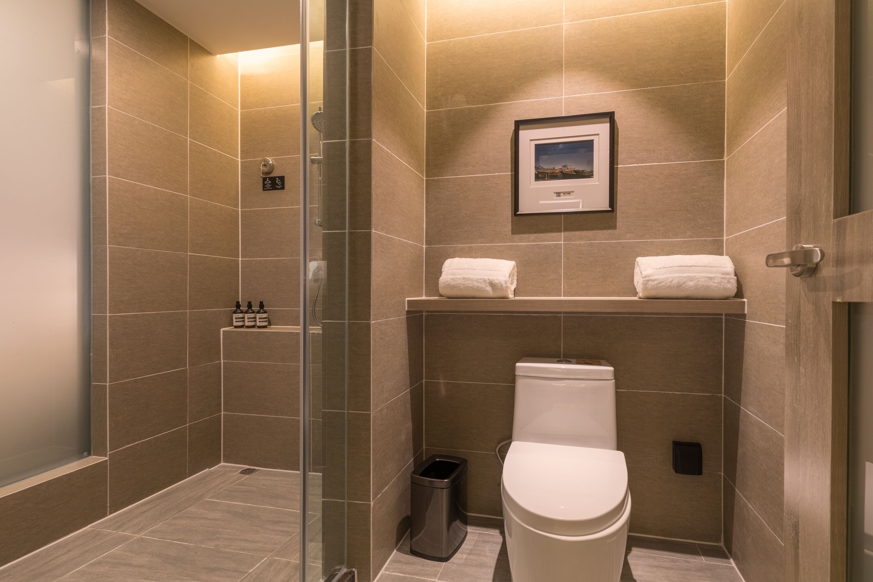 deluxe room | bathroom | shower, hair dryer, dressing gowns