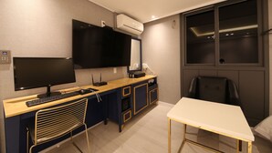 A modern office space with a desk, computer, and chair. - Hotel Cheese (Busan)
