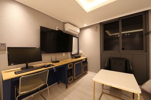 A modern office space with a desk, computer, and chair. - Hotel Cheese (Busan)