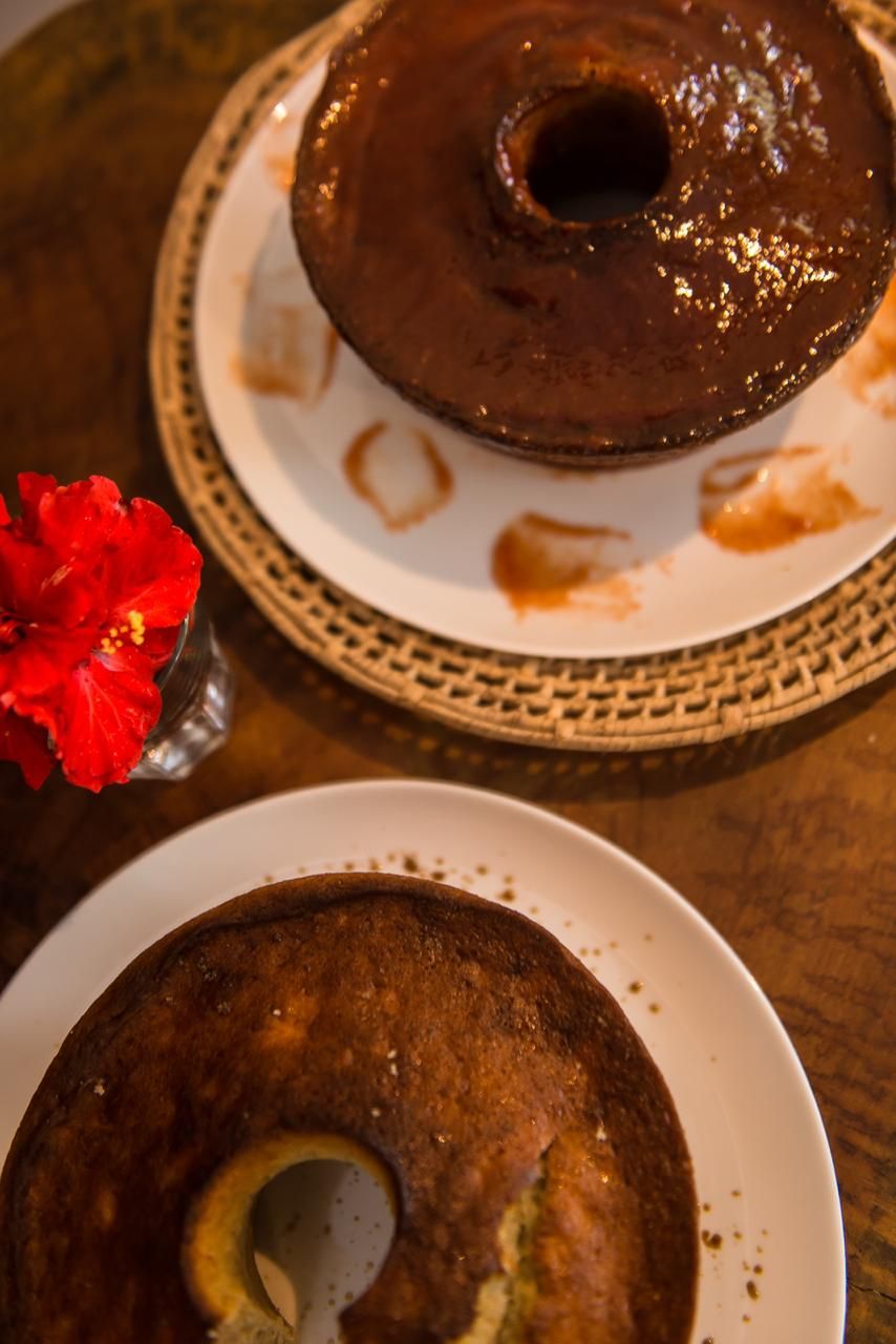 A cake with a hole in the center on a plate.