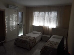 Comfort Apartment, Sea View | 2 bedrooms, in-room safe, desk, free rollaway beds