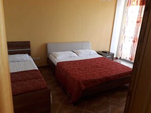 Comfort Apartment, Sea View | 2 bedrooms, in-room safe, desk, free rollaway beds