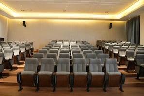 Conference room with seating for meetings and presentations.