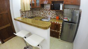Apartment, 2 Bedrooms | Private kitchen | Fridge, microwave, stovetop, cookware/dishes/utensils