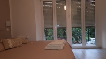 Premium bedding, desk, laptop workspace, blackout curtains