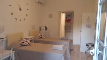 Premium bedding, desk, laptop workspace, blackout curtains