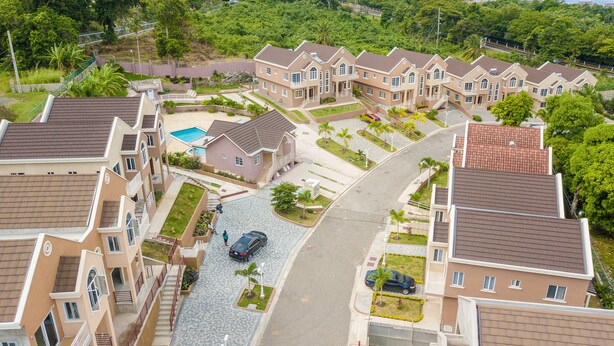 A residential area with multiple two-story houses, a central road, and a swimming pool. - Tropical Luxury Dreams Ocho Rios (Ocho Rios)