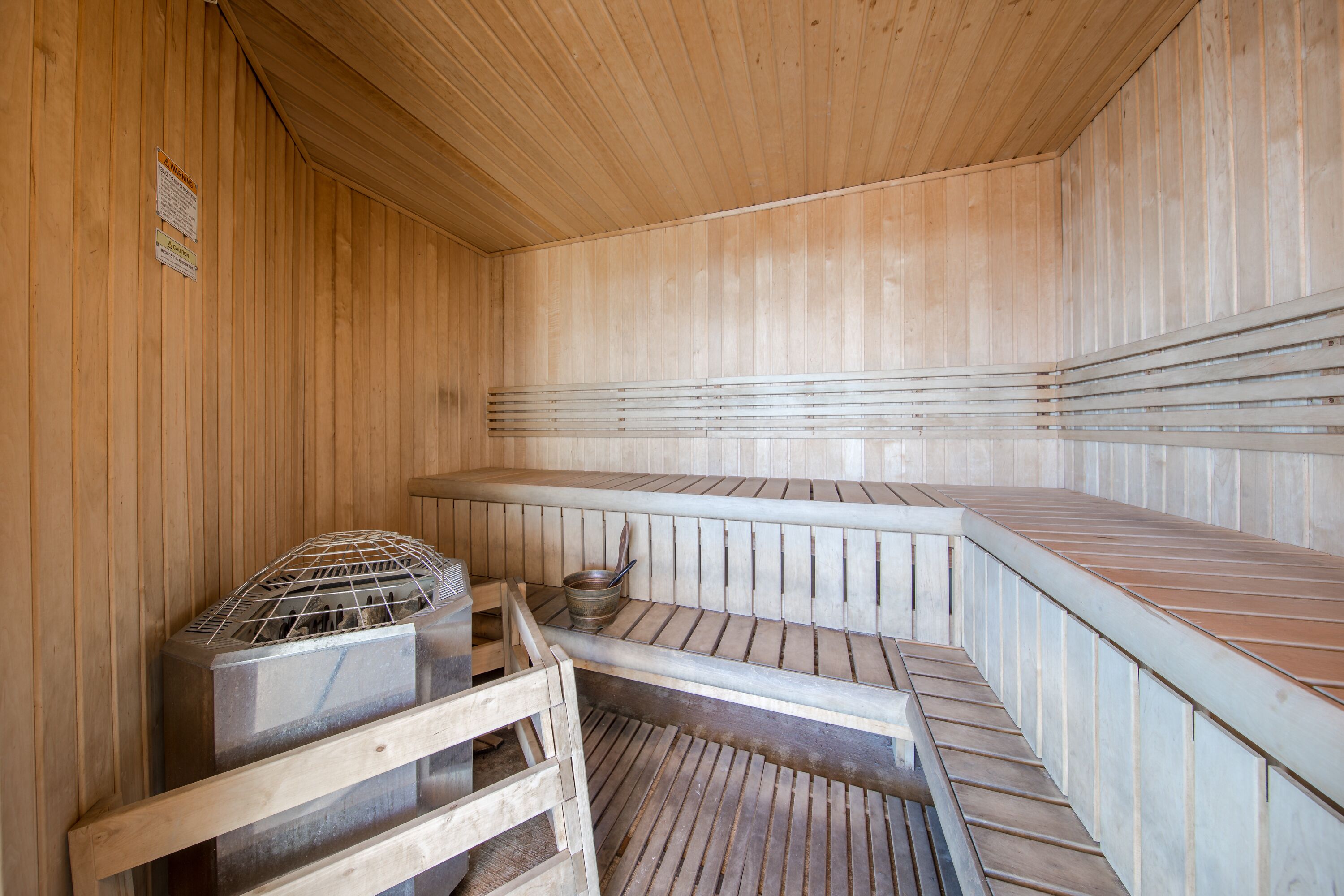 A sauna with wooden walls and benches.