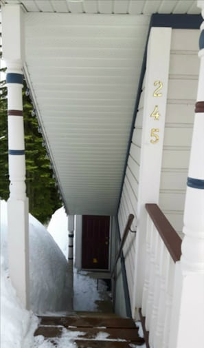 Stroll up the covered porch to a warm and inviting entrance.
