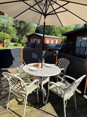 Outdoor dining - A beautiful Cabin on the 5 star White Cross Bay in a quiet area of the park - (Windermere)