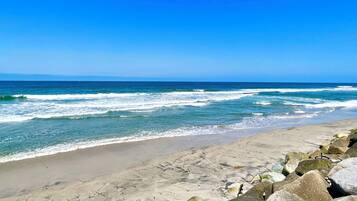 On the beach, sun loungers, beach towels