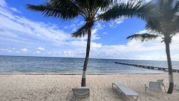 On the beach, sun loungers, beach towels