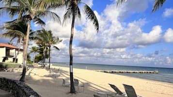 On the beach, sun loungers, beach towels