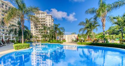 Luxury condo with balcony, ocean & jungle views - open layout